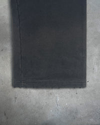 Detail view of pant cuff on HIKIKKOMORI SWEATPANTS — Heavyweight French Terry in faded black