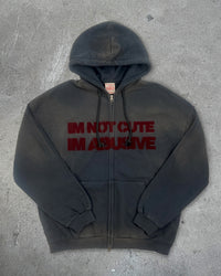 Front view of I'M NOT CUTE I'M ABUSIVE — Zip Hoodie | Heavyweight French Terry in faded black