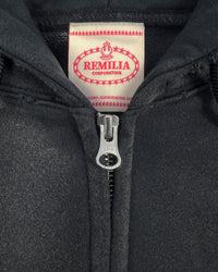 Detail view of tag on I'M NOT CUTE I'M ABUSIVE — Zip Hoodie | Heavyweight French Terry in faded black