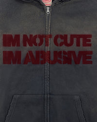 Detail view of I'M NOT CUTE I'M ABUSIVE — Zip Hoodie | Heavyweight French Terry in faded black