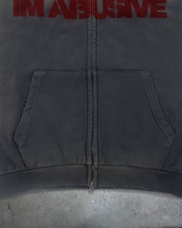 Detail view of distressed ribbing on I'M NOT CUTE I'M ABUSIVE — Zip Hoodie | Heavyweight French Terry in faded black