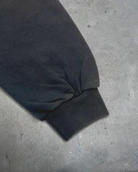 Detail view of distressed cuff on I'M NOT CUTE I'M ABUSIVE — Zip Hoodie | Heavyweight French Terry in faded black