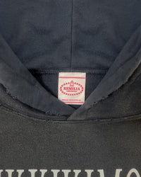Detail view of tag on HIKIKKOMORI CONDITION — Hoodie | Heavyweight French Terry in faded black