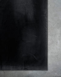 Detail view of hem distressing on HIKKIKIMORI CONDITION — T-Shirt | Heavyweight Cotton in distressed black
