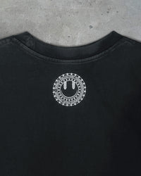 Detail view of Remilia smiley logo on I'M CUTE I'M PUNK ROCK — T-Shirt | Heavyweight Cotton in distressed black