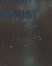 Detail view of hand-paint splatter on AVANT ART TERRORIST — T-Shirt | Combed Cotton in faded black