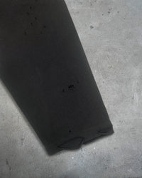 Detail view of sleeve hem distressing on EXIT SOCIETY 100% NEET GOD — Double-Layer L/S Cut Sewn in faded black