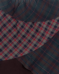 Detail view of layered pattern on SCHIZO TARTAN SKIRT — Asymmetrical Layered Skirt | Washed Cotton in red tartan