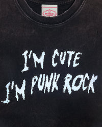 Detail view of slogan on I'M CUTE I'M PUNK ROCK — Crop T-Shirt | Heavyweight Cotton in distressed black