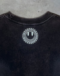 Detail view of Remilia smiley logo on I'M CUTE I'M PUNK ROCK — Crop T-Shirt | Heavyweight Cotton in distressed black
